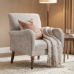 Fauteuil Ourval élégant confortable en tissu taupe clair pieds bois massif